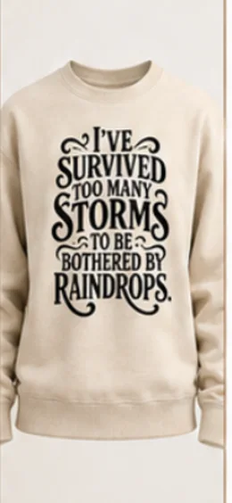 The design printed in black on a beige crewneck sweatshirt